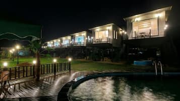 Seasonal outdoor pool, open 3:00 PM to 8:00 PM, pool umbrellas