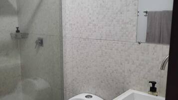 Shower, towels, soap, toilet paper