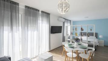 Apartemen (55 m2) | Ruang keluarga | TV layar datar