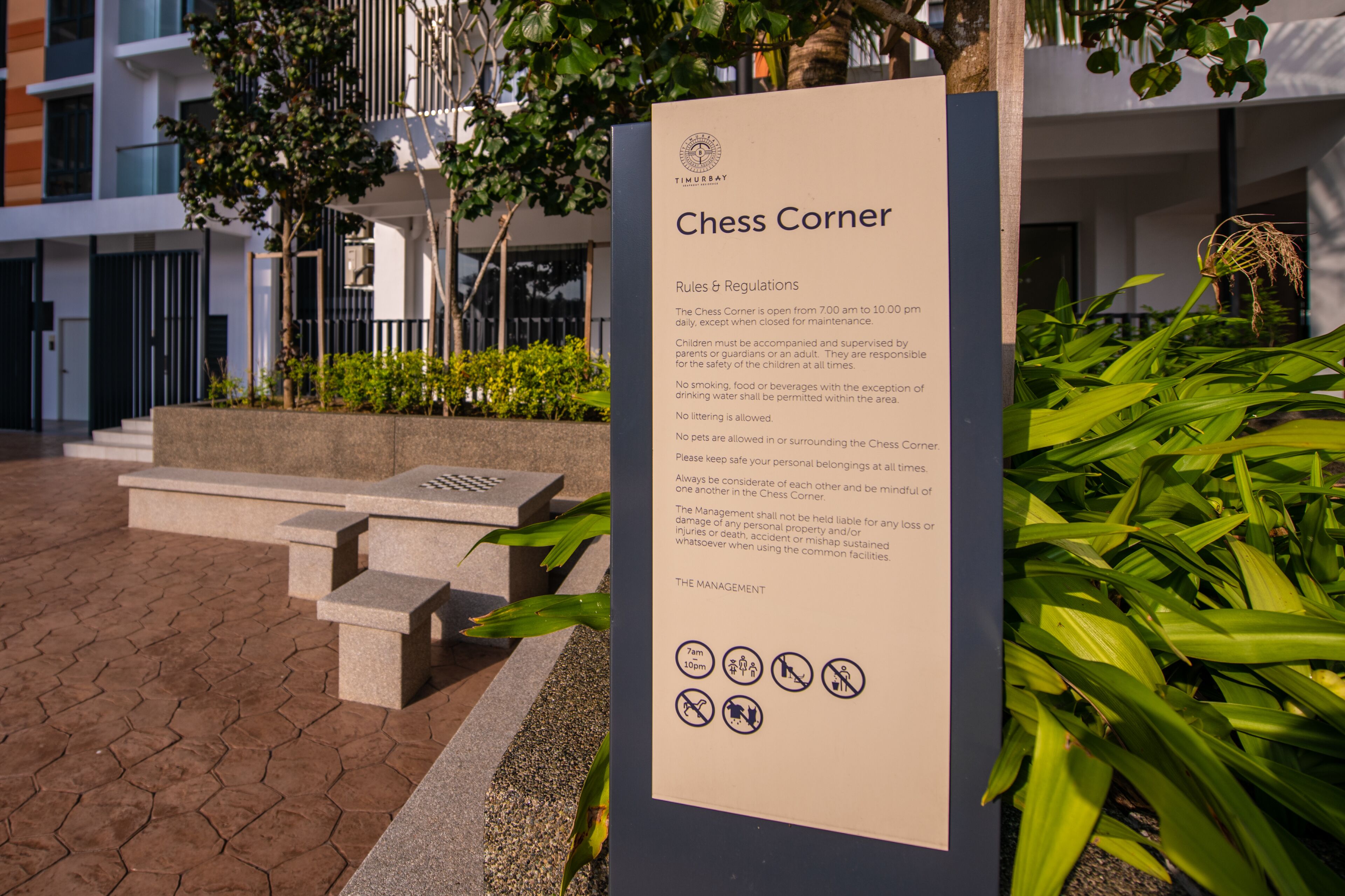 A signboard titled "Chess Corner" with rules and regulations.