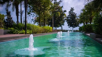 4 outdoor pools, open 7:00 AM to 10:00 PM, pool umbrellas