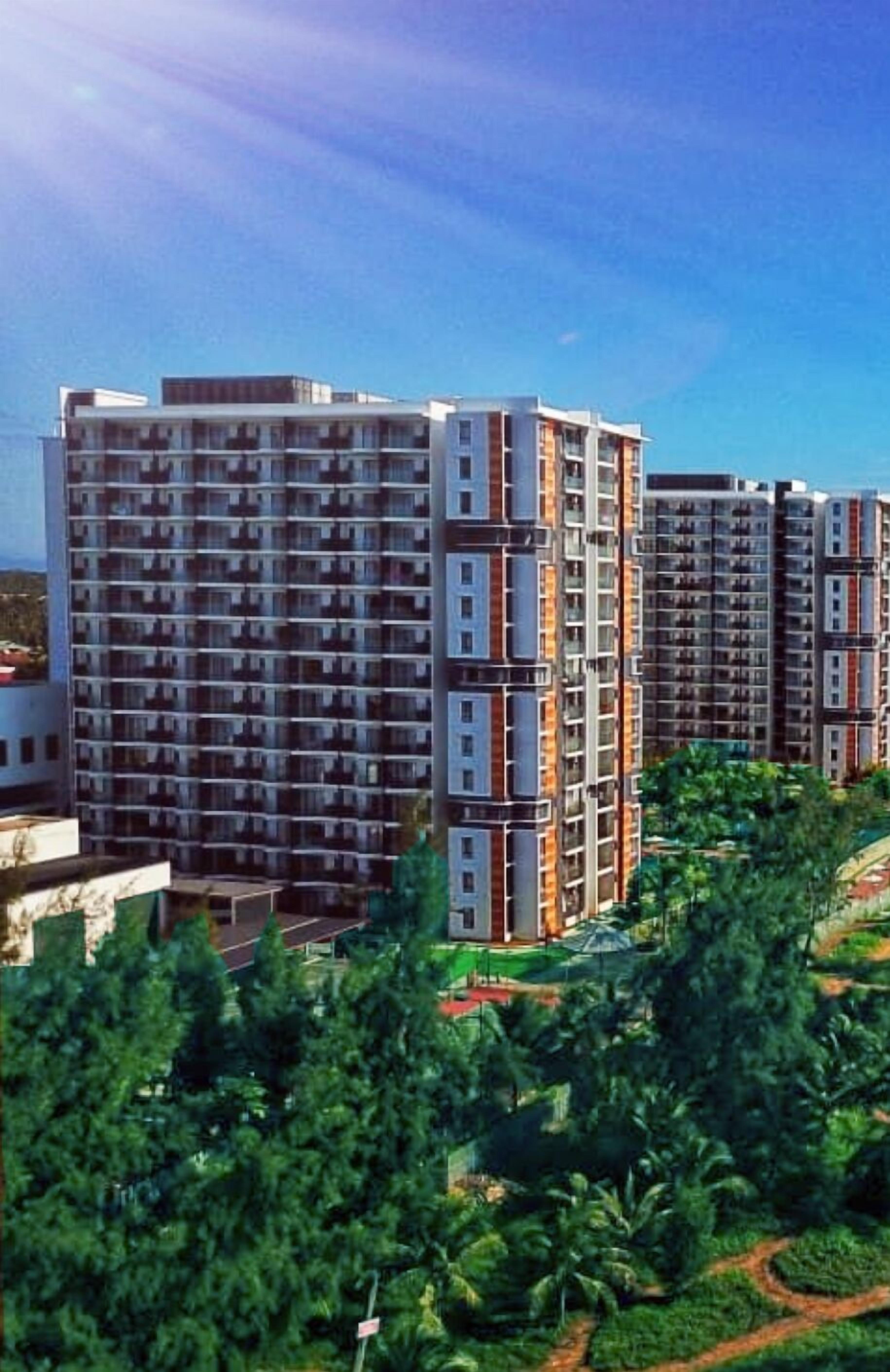A high-rise residential building with multiple balconies and a modern architectural design.