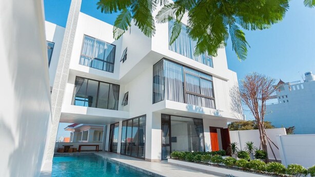 A modern two-story house with a swimming pool, large windows, and a well-maintained garden. - Villa Viba (Ho Chi Minh City)