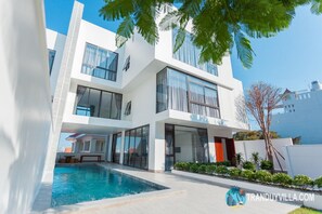 A modern two-story house with a swimming pool, large windows, and a well-maintained garden. - Villa Viba (Ho Chi Minh City)