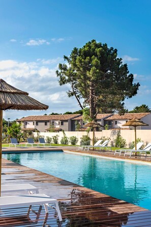 Outdoor pool, a heated pool, pool loungers