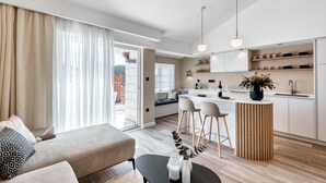 A modern apartment with a living area, kitchen, and dining space. - Villa Boro 4 (Dubrovnik)