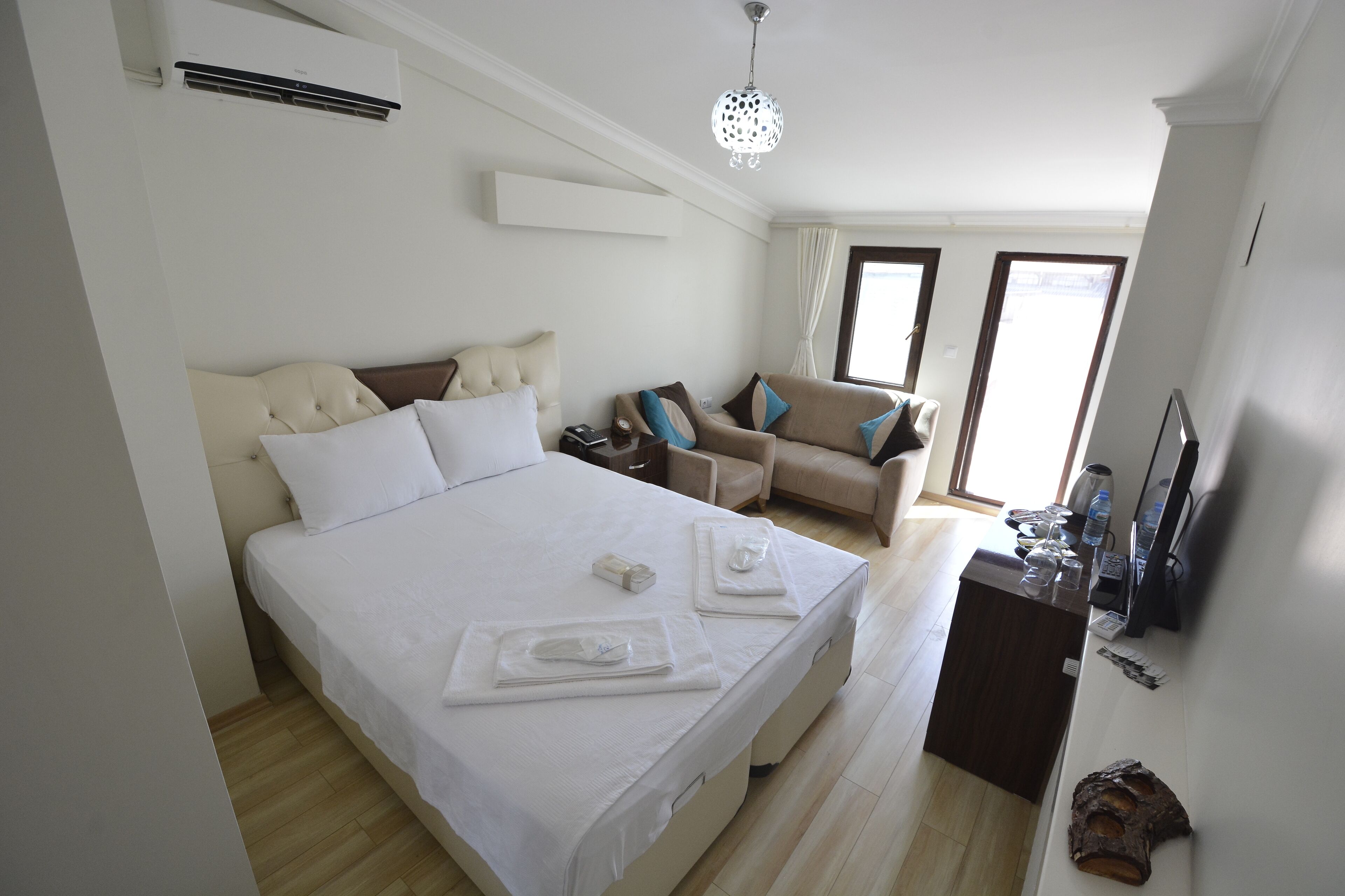 Standard Triple Room | Minibar, desk, laptop workspace, blackout curtains