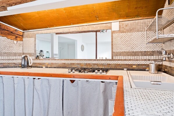 Fridge, stovetop, dining tables