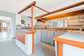 Fridge, stovetop, dining tables