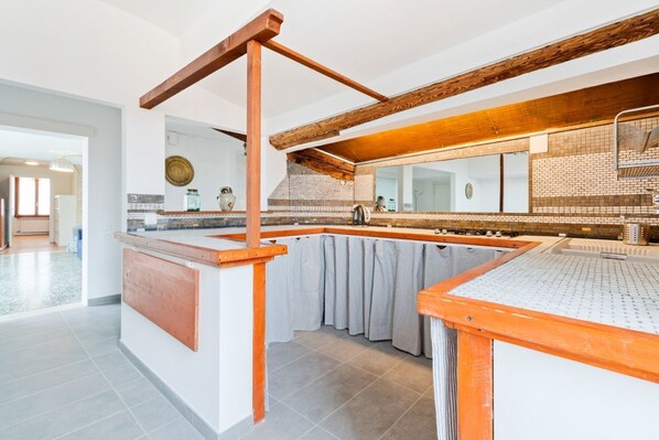 Fridge, stovetop, dining tables