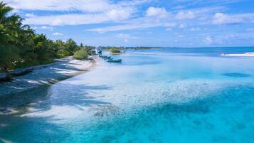 On the beach, white sand, beach towels, fishing