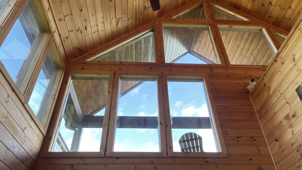 A high-ceilinged room with wooden beams, skylights, and a ceiling fan. - Princesses Mountain View ,  Romantic/Honeymoon getaway   (Sevierville)