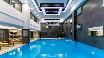 Indoor pool, open 8:00 AM to 11:00 PM, pool loungers