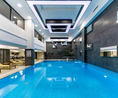 Indoor pool, open 8:00 AM to 11:00 PM, pool loungers