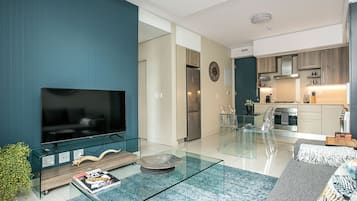 Deluxe Apartment, 1 Bedroom | Living area | 42-inch flat-screen TV with digital channels, TV