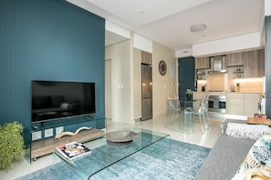 Deluxe Apartment, 1 Bedroom | Living area | 42-inch flat-screen TV with digital channels, TV