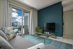 Deluxe Apartment, 1 Bedroom | Living area | 42-inch flat-screen TV with digital channels, TV