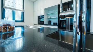 Luxury Apartment | Private kitchen | Full-size fridge, oven, stovetop, dishwasher