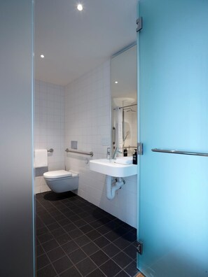 Room, 1 King Bed (Mobility Accessible, Roll-In Shower) | Bathroom | Shower, hydromassage showerhead, eco-friendly toiletries, hair dryer