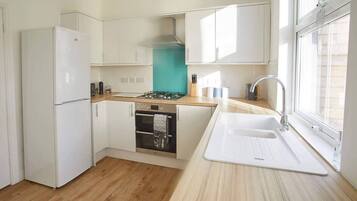 Coffee/tea maker, fridge, microwave, oven