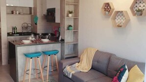 Standard Apartment | Living area | 32-inch LCD TV with cable channels, TV