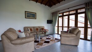 Apartamento Deluxe | Zona de estar