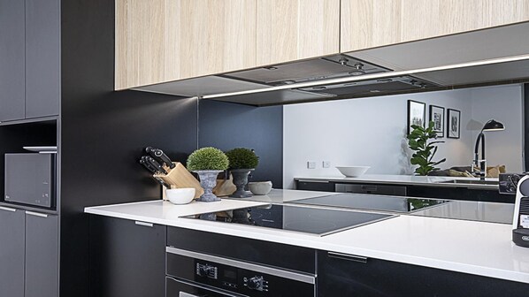 Fridge, microwave, oven, stovetop - Canberra Chic is a Luxurious One-bedroom apartment near Canberra's CBD (Campbell)