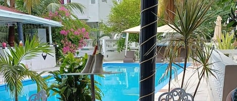 Breakfast, lunch, dinner served; Caribbean cuisine, pool views