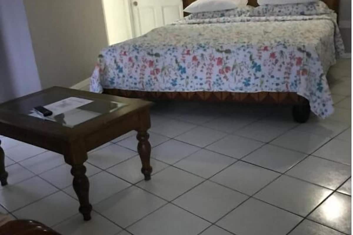 Family Apartment | Desk, laptop workspace, blackout drapes, iron/ironing board