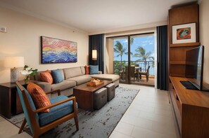 Relax in this stylish room with a sofa, coffee table, and flat-screen TV, plus a balcony with ocean views.