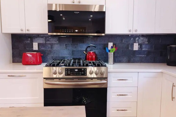 Handmade backsplash from Spain delights with a variety of blue designs and hues.