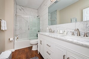 Combined shower/bathtub, hair dryer, towels, soap