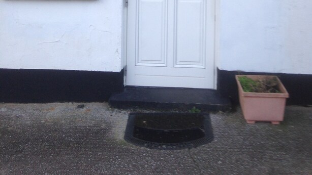 A white door with a glass panel, a window with blinds, and a sign that reads "The Tuckroom". - The Tackroom is a one bedroom Apartment just a short walk from Fanore Beach (Ballyvaughan)