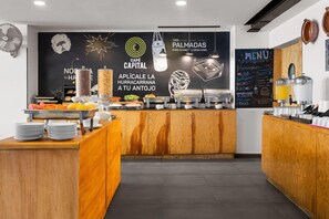 A café with a blackboard menu, wooden counter, and various food items displayed. - Hotel MX lagunilla CDMX, Trademark Collection by Wyndham (Mexico City)