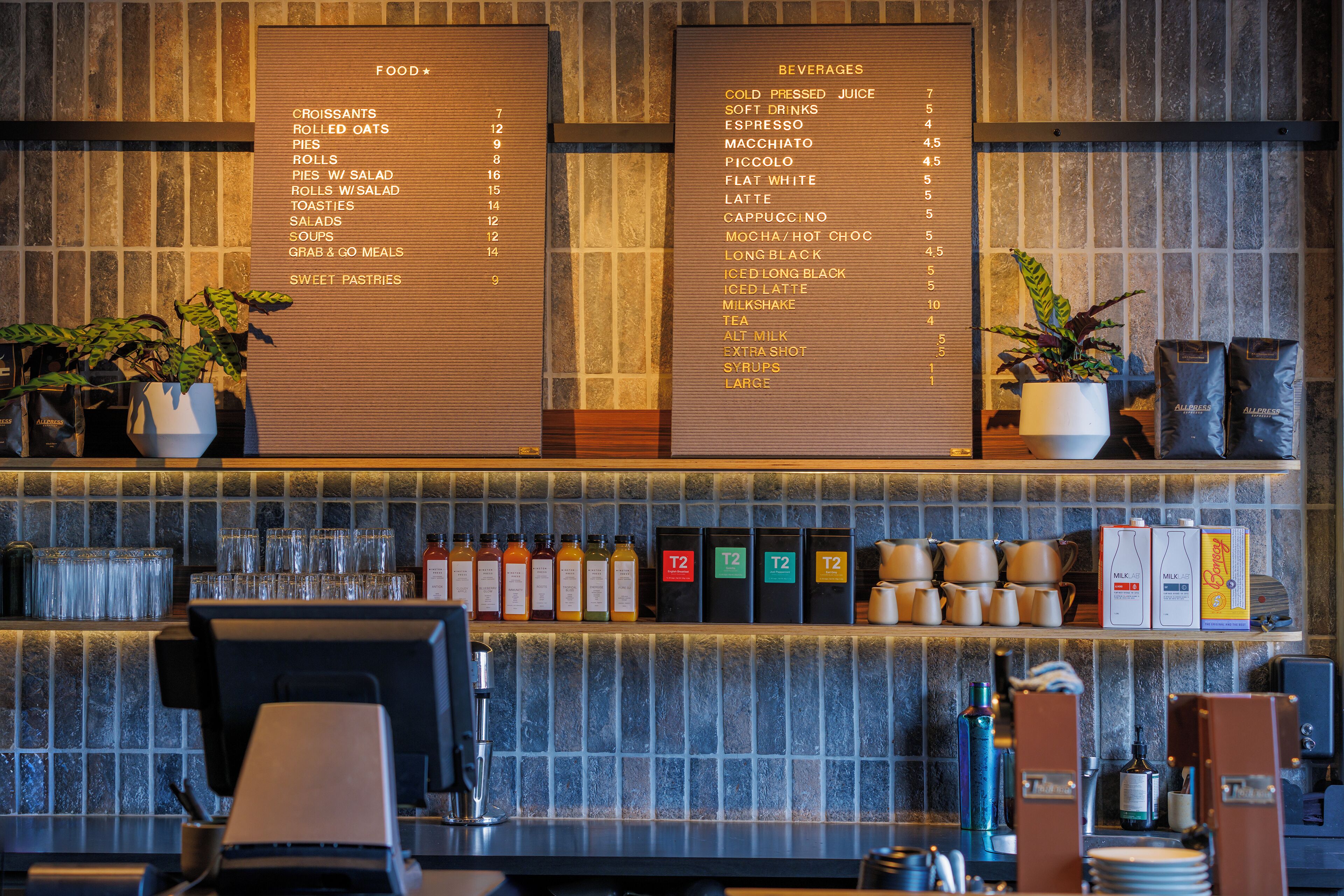 A restaurant menu board with food and beverage options.