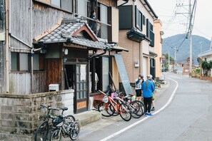A building with a traditional tiled roof and a wooden facade. - Hostel Dockhouse (Nagasaki)