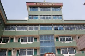 A multi-story building with a sign reading "HOTEL CARRISSIMA". - OYO 1389 Hotel Carissima (Palembang)