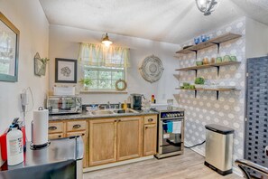 Fridge, stovetop, dishwasher, coffee/tea maker