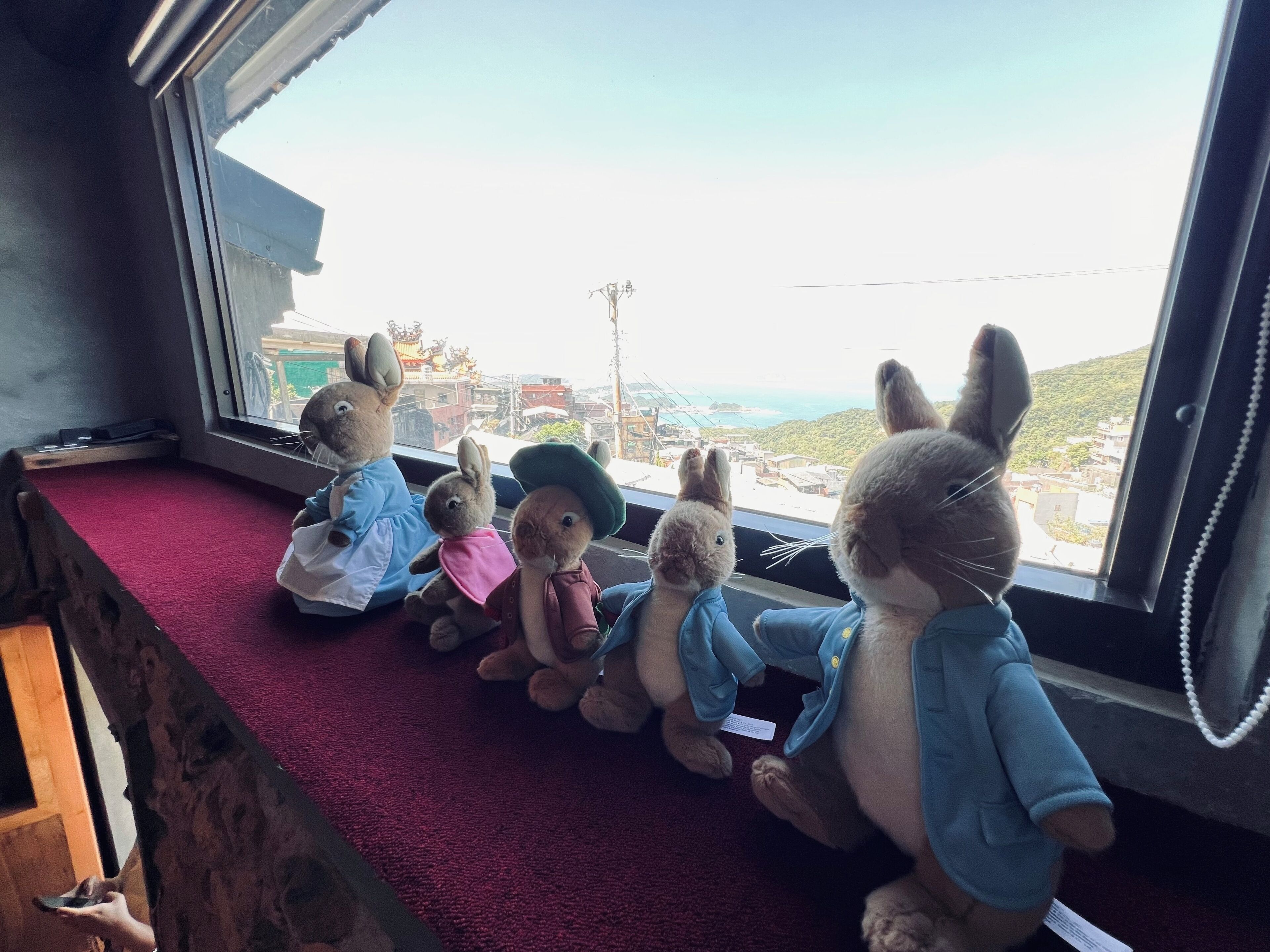 A window seat with plush toys.