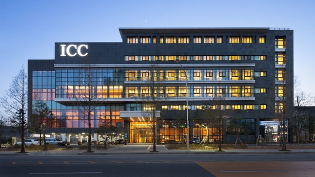 A modern building with the "ICC" sign, featuring multiple floors, large windows, and a well-lit entrance. - Hotel ICC (Daejeon)
