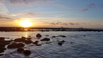 On the beach, sun loungers
