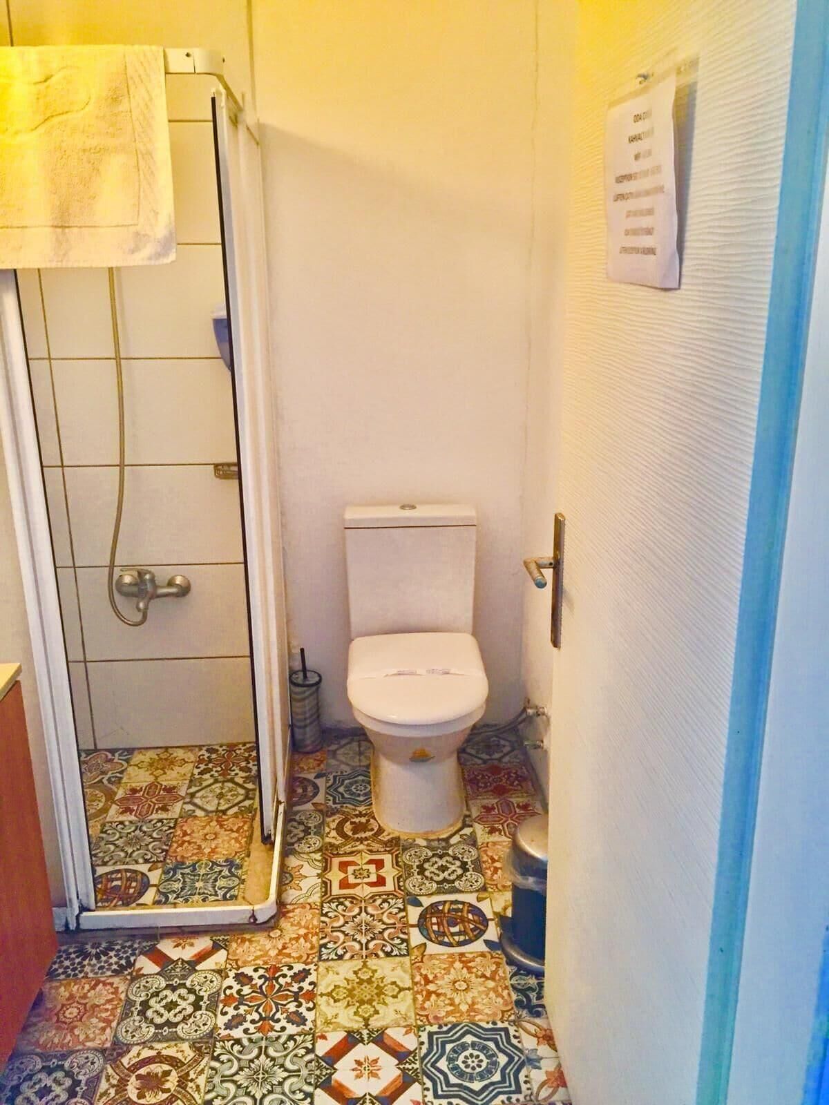 Bathroom | Shower, rainfall showerhead, hair dryer, slippers