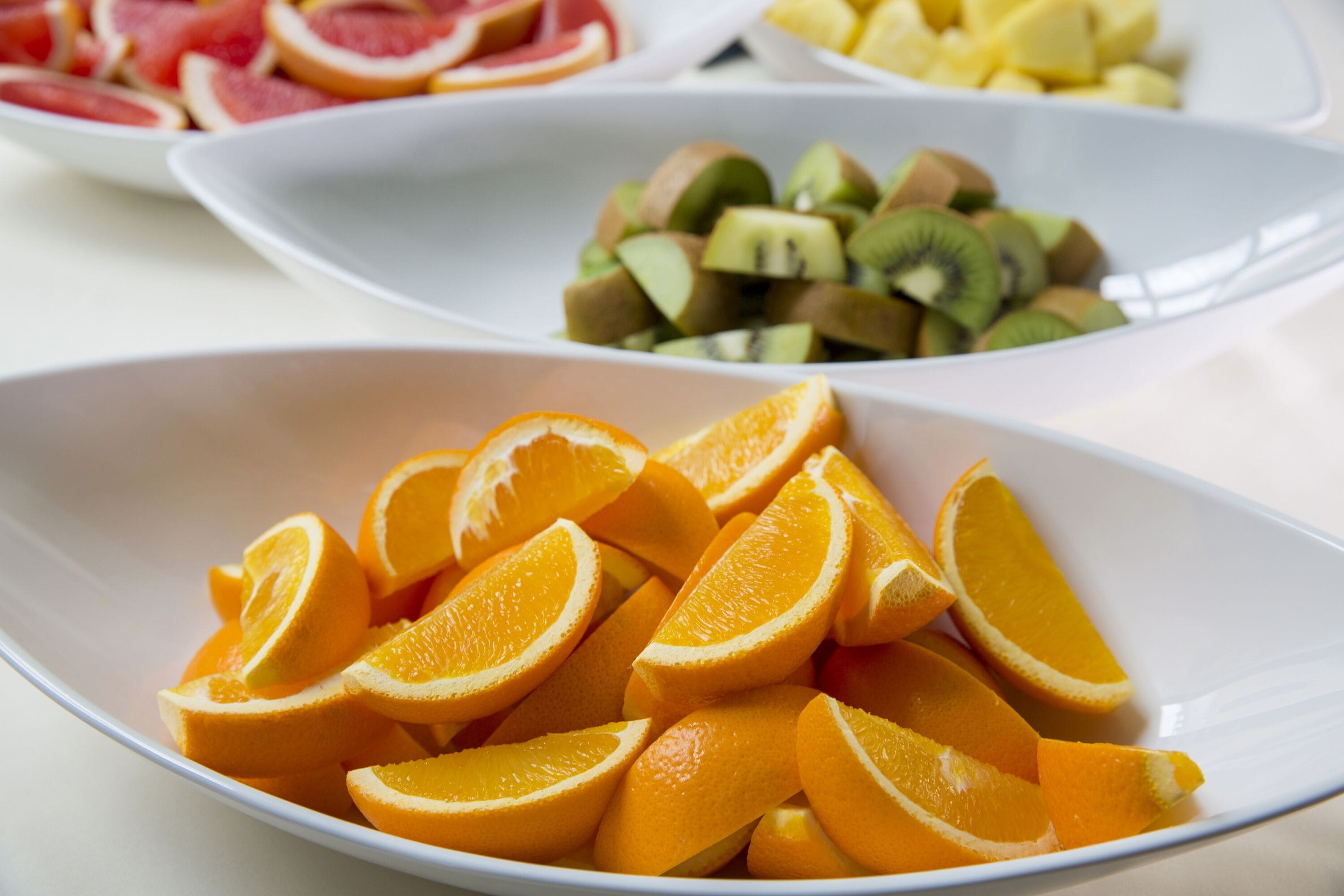 A white plate with orange slices.