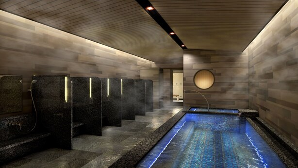 A modern spa with a long, narrow pool, multiple shower stalls, and a minimalist design. - Hotel Monterey KOBE (Kobe)