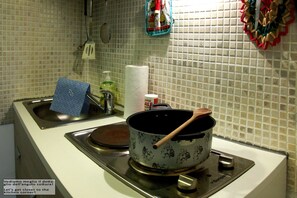 Fridge, coffee/tea maker, electric kettle, cookware/dishes/utensils