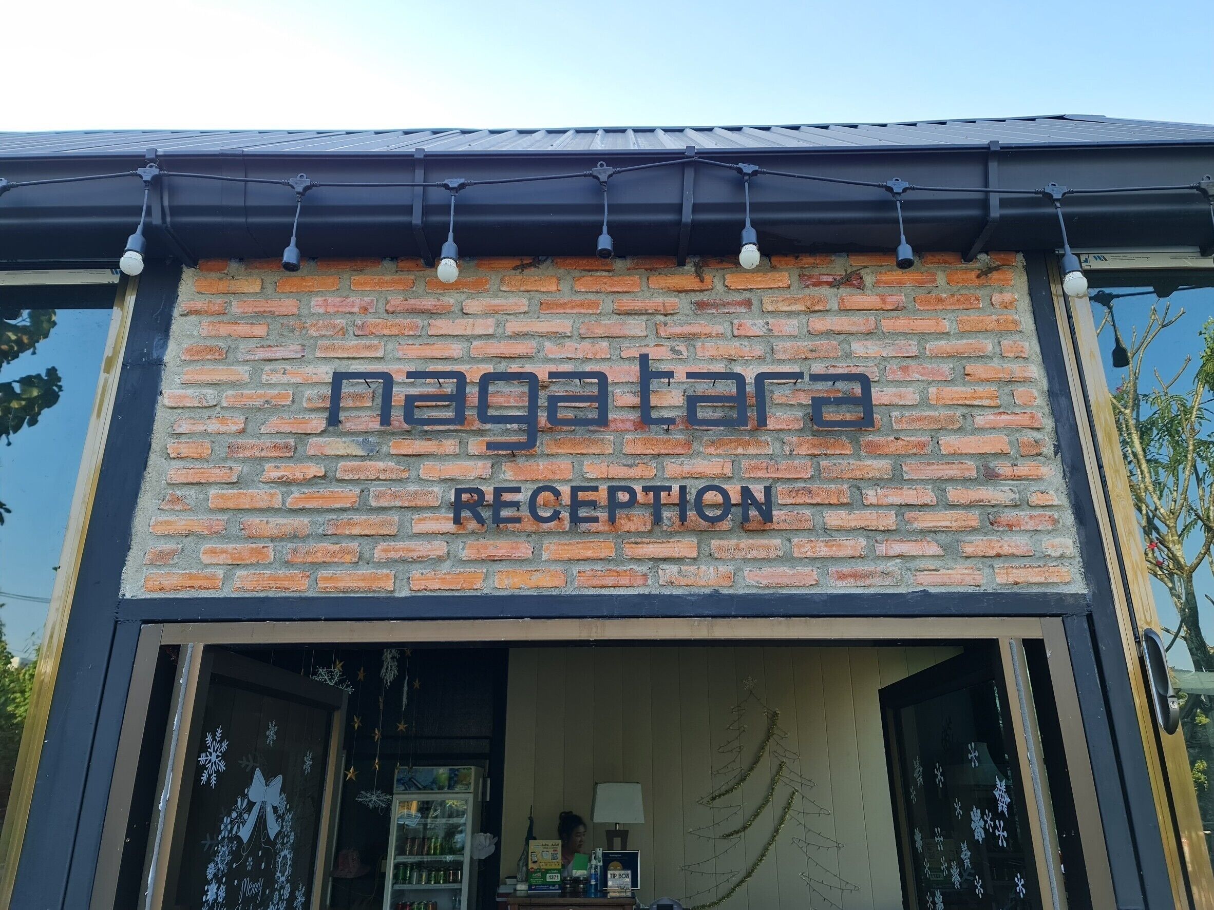 A brick building with a sign reading "nagatara reception".