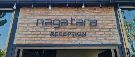 A brick building with a sign reading "nagatara reception".