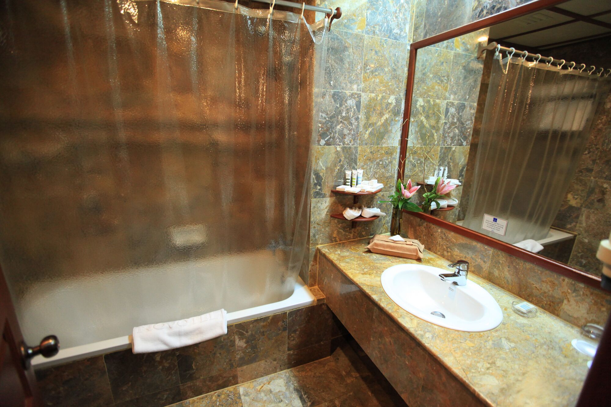 combined shower/bathtub, free toiletries, hair dryer, slippers