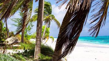 On the beach, sun-loungers, beach towels