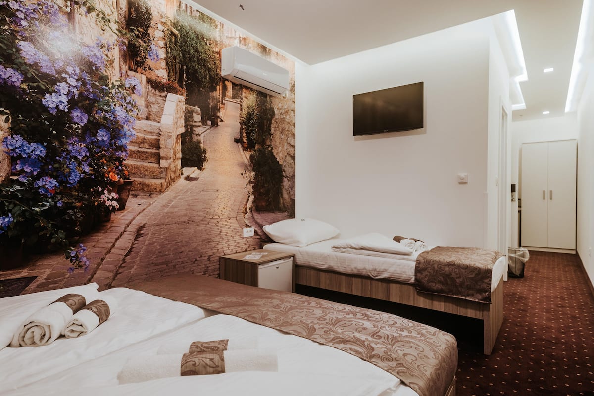 Superior Triple Room | Minibar, in-room safe, individually decorated, individually furnished